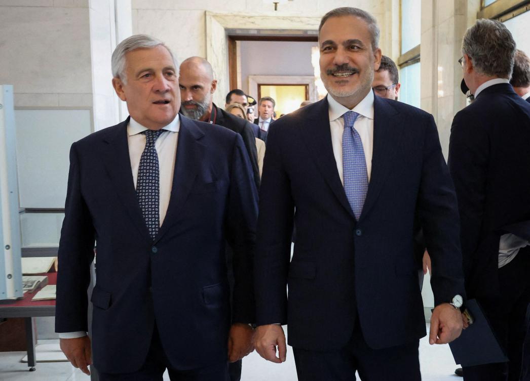 This handout photograph taken and released by Turkish Foreign Ministry on Sept. 11, 2025, shows Italy’s Foreign Minister Antonio Tajani walking with Turkiye’s Foreign Minister Hakan Fidan during their meeting in Rome. (AFP)