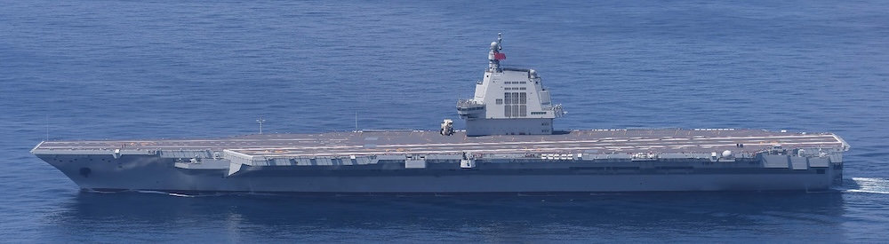 Above, China’s third and newest aircraft carrier, the Fujian, sails in the East China Sea in this handout photo taken by Japan’s Ministry of Defense on Sept. 11, 2025. (Japan’s Ministry of Defense via Jiji Press/AFP)