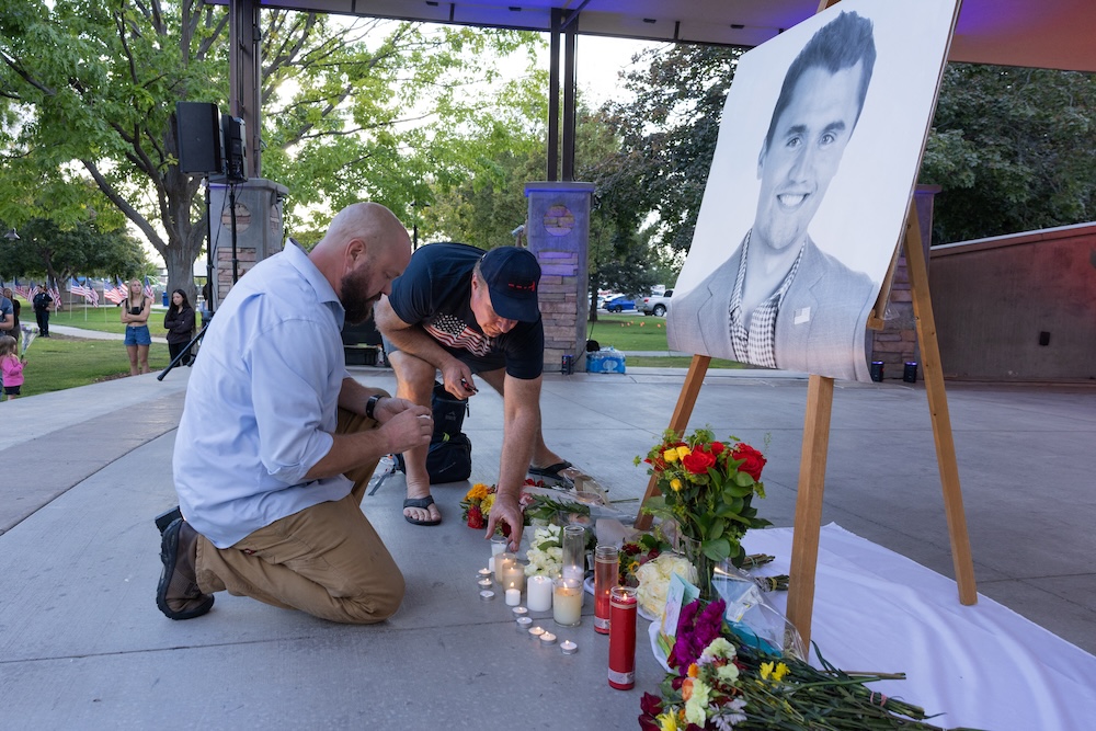 People pay their respects during a candlelight vigil for youth activist and influencer Charlie Kirk at a makeshift memorial at Orem City Center Park in Orem, Utah on Sept. 11, 2025. (AFP)