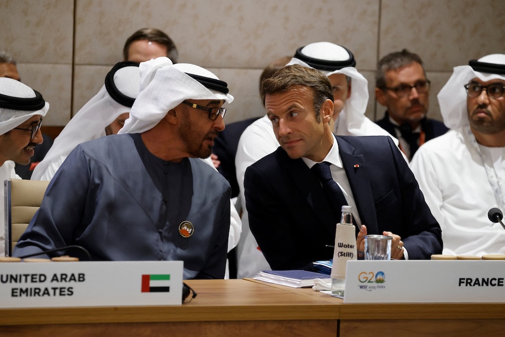 Above, UAE’s President Sheikh Mohamed bin Zayed speaks with France’s President Emmanuel Macron during a session of the G20 Leaders’ Summit in New Delhi on Sept. 9, 2023. (AFP file photo)