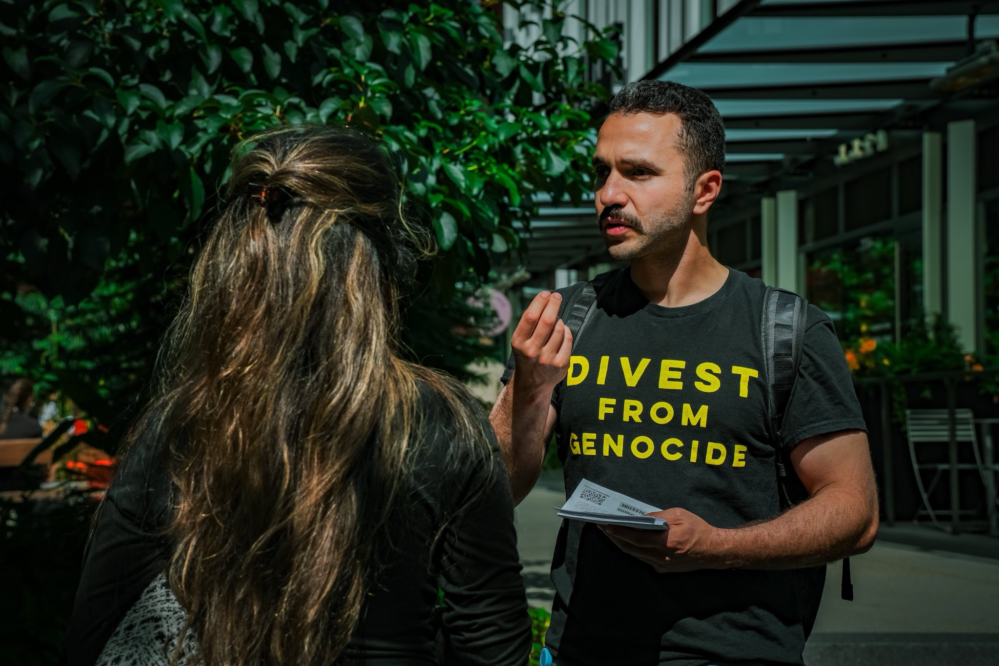 Despite his suspension, Ahmed Shahrour and community supporters distributed flyers outside the company’s Seattle headquarters to protest Amazon’s work with Israel. (Supplied)