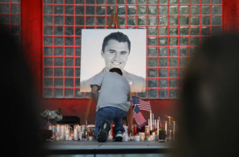A man places a candle during a vigil at Orem City Center Park, after US right-wing activist and commentator, Charlie Kirk, an ally of US President Donald Trump, was fatally shot during an event at Utah Valley University, in Orem, Utah, Sept. 11, 2025. (Reuters)