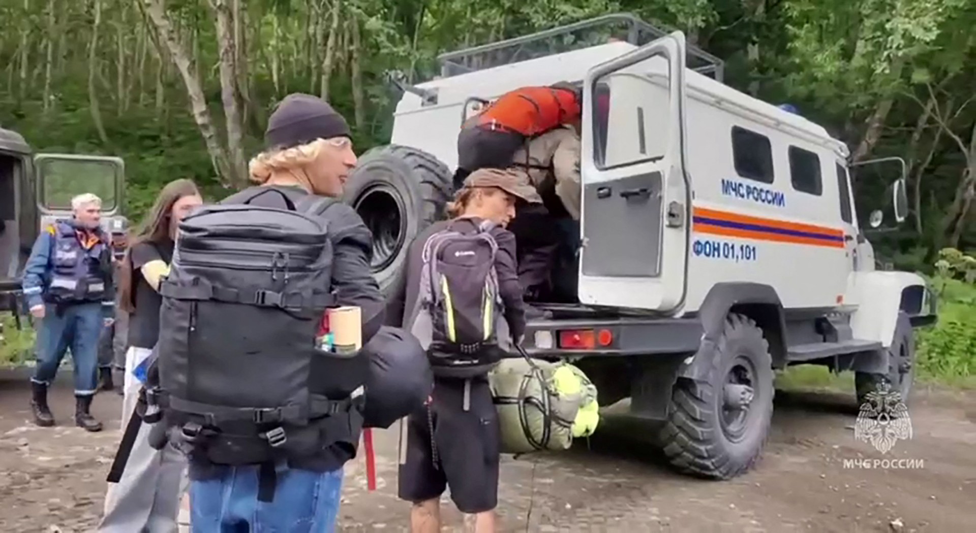 This grab taken from a handout video released by the Russian Ministry of Emergency Situations on July 30, 2025 shows rescuers evacuating people in Russia's Kamchatka region after an 8.8 magnitude earthquake struck off Russia's far east coast. (AFP)