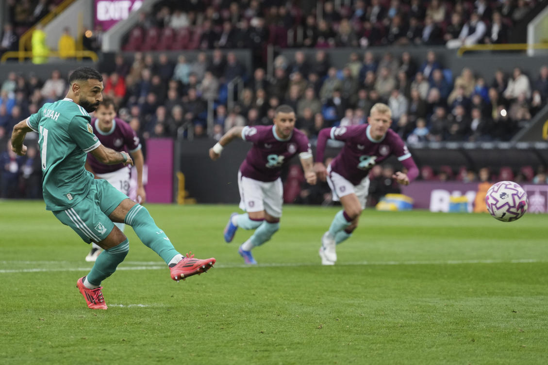 Liverpool's Mohamed Salah scores from a penalty kick during the Premier League match with Burnley. (AP)