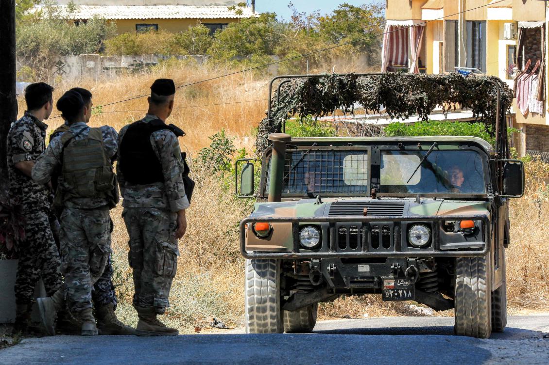 A Lebanese army vehicle approaches soldiers stationed in Lebanon's southern city at the weekend. (AFP)
