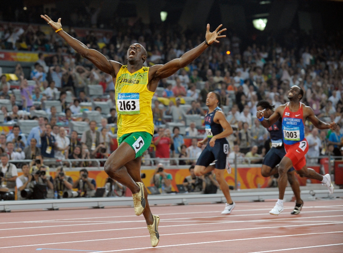 Jamaica's Usain Bolt celebrates as he wins the men's 200 meter final with a world record during the athletics competitions in the National Stadium at the Beijing 2008 Olympics in Beijing, China. (AP)