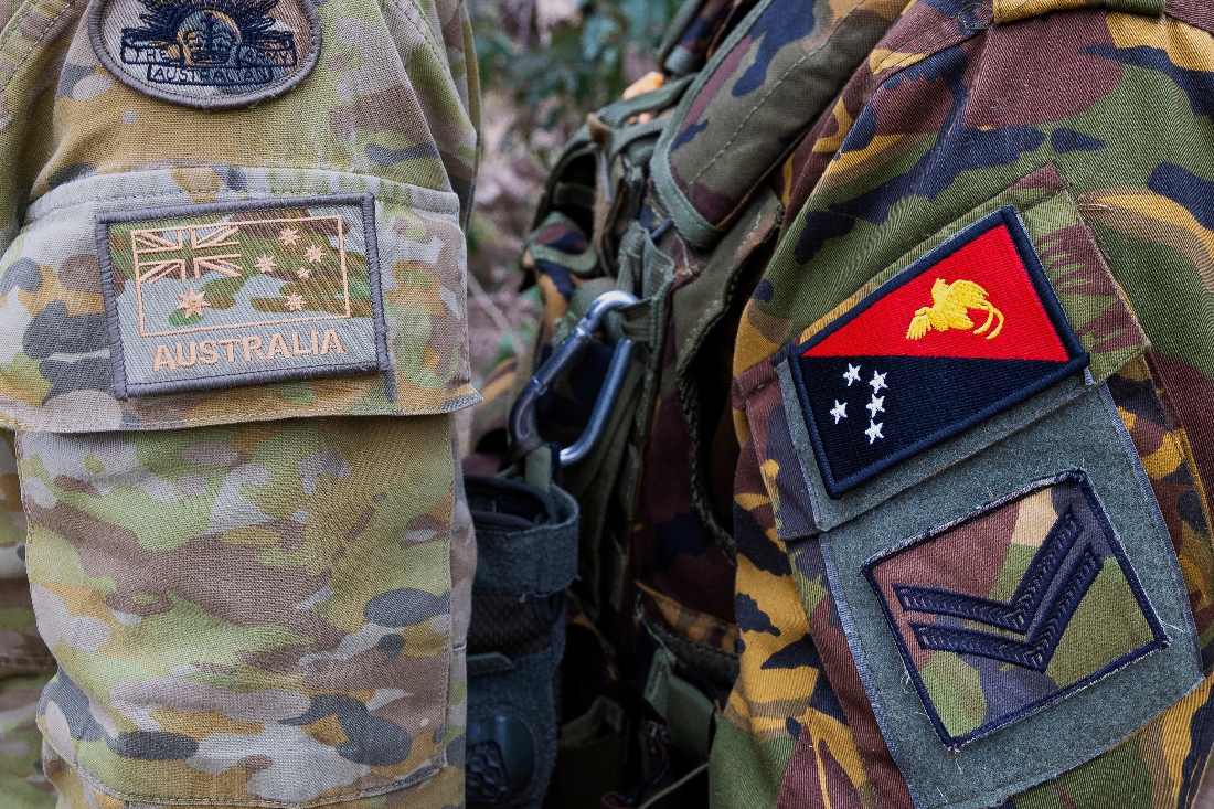 Emblem of an Australian Army soldier, left, and a Papua New Guinea Defence Force soldier during an exercise at Talisman Sabre in Townsville, Australia. (AP)