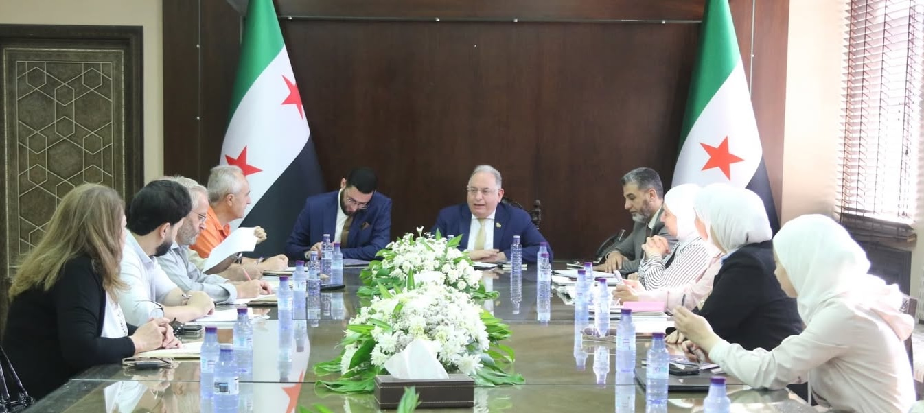 Syrian Finance Minister Yisr Barnieh attends a committee meeting on drafting a legislative framework for state-owned economic enterprises with senior officials and industry representatives. Facebook