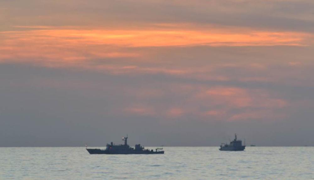 Above, Chinese surveillance ships off Scarborough Shoal in this undated photo. China earlier approved plans to turn the shoal into a national nature reserve. (DFA/PN/AFP file photo)
