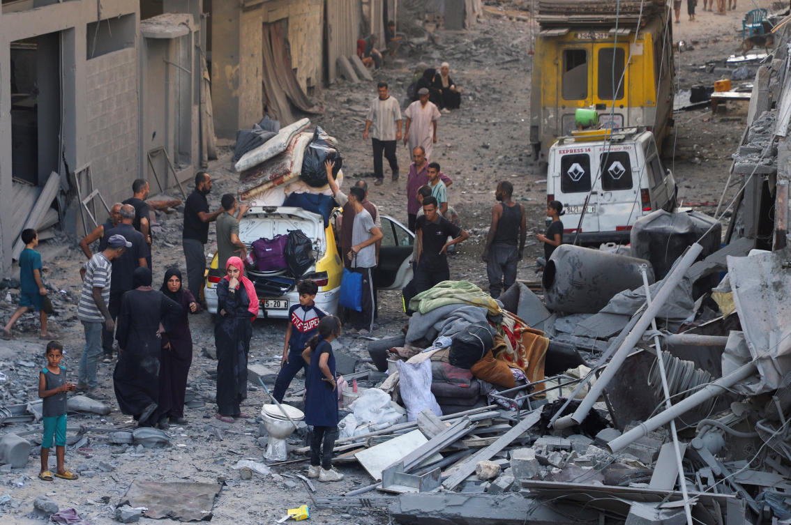 Palestinians inspect the site of an overnight Israeli strike on a house in Gaza City on Sept. 16, 2025. (Reuters)