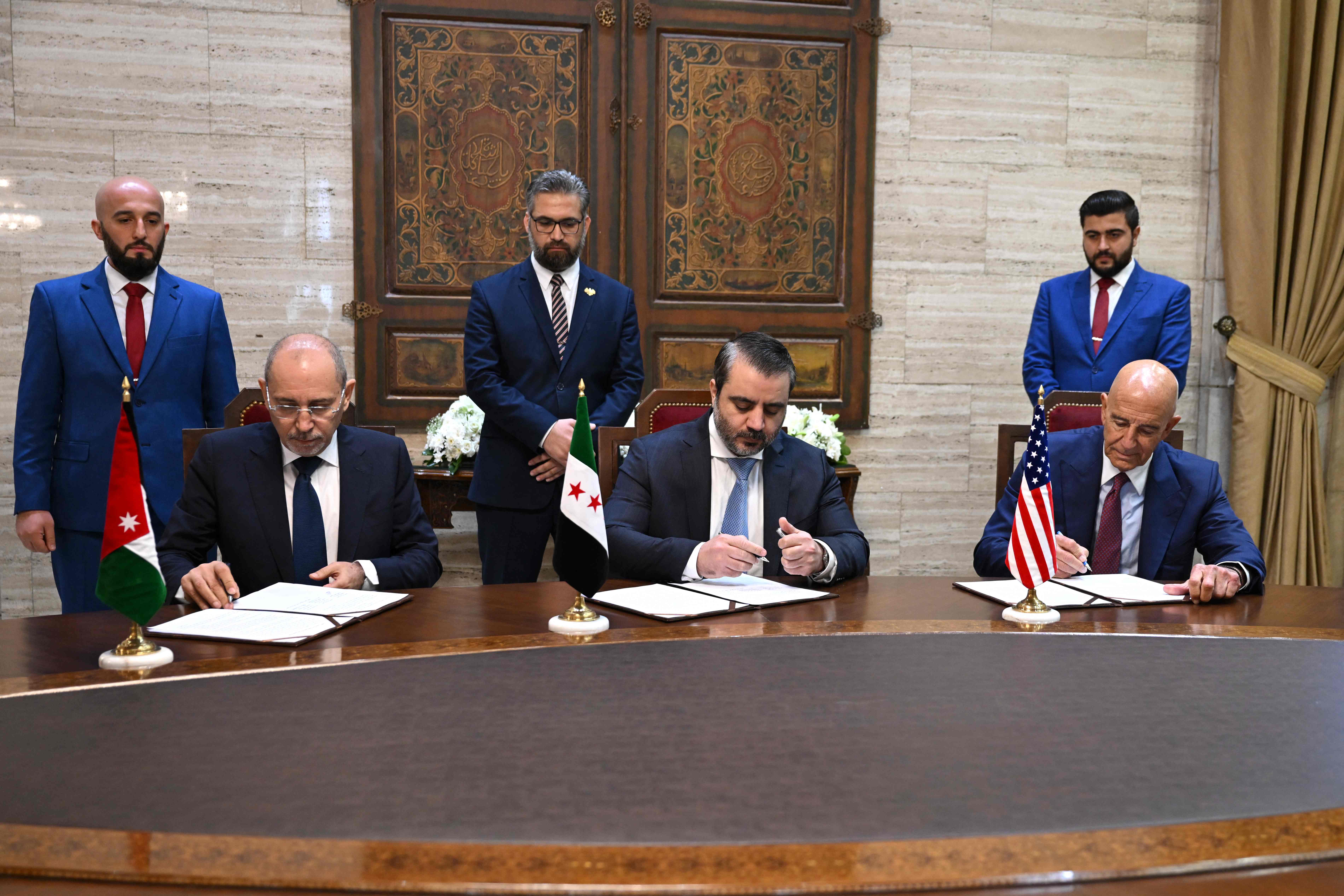 Jordan’s Foreign Minister Ayman Safadi, Syrian Foreign Minister Asaad Al-Shaibani and US special envoy for Syria Tom Barrack sign an agreement in Damascus on September 16, 2025. (AP)