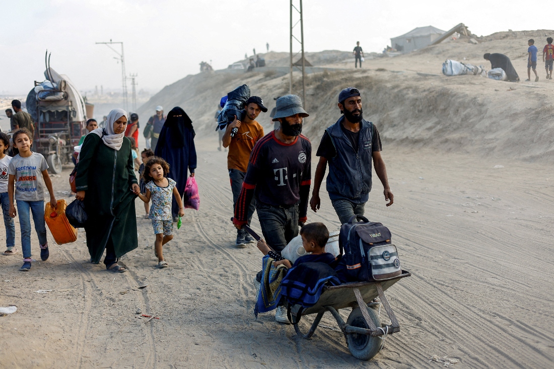 Displaced Palestinians, fleeing northern Gaza due to an Israeli military operation, move southward after Israeli forces ordered residents of Gaza City to evacuate, in the central Gaza Strip. (Reuters)