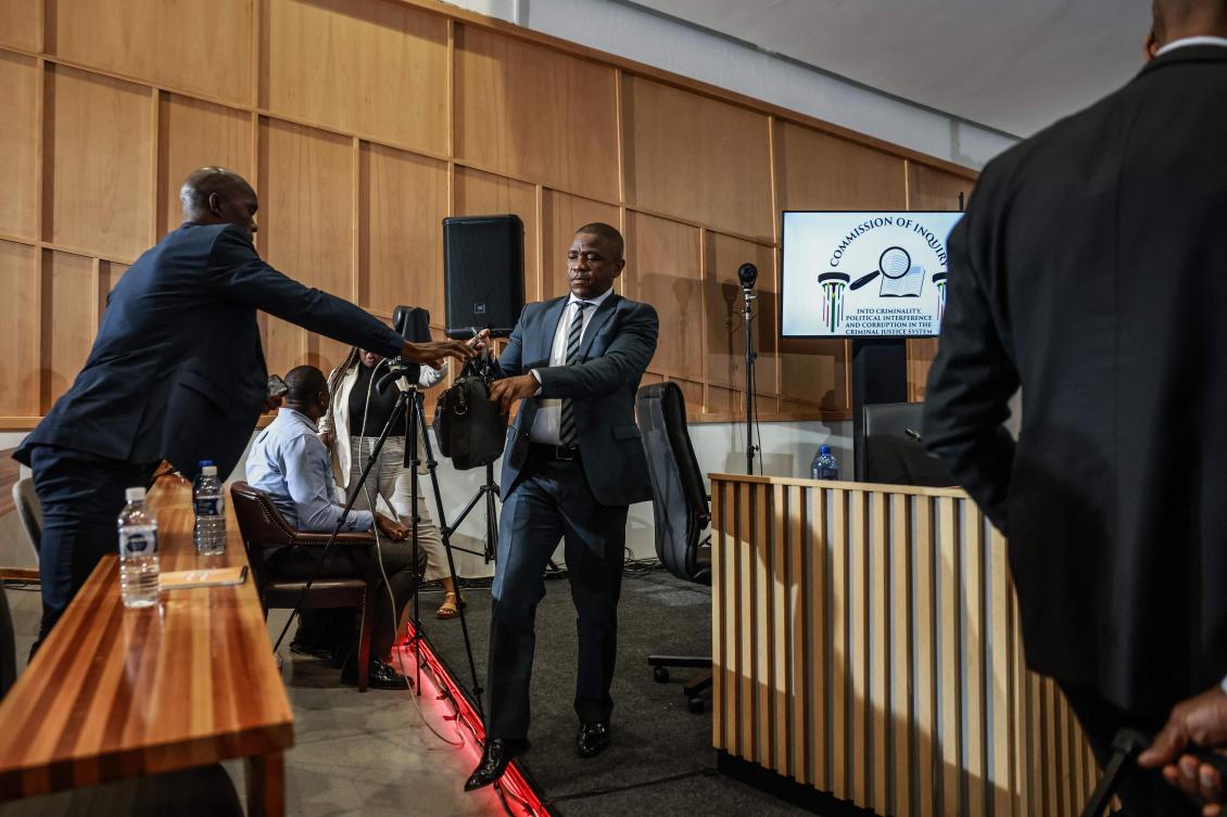 South African Provincial Police Commissioner Nhlanhla Mkhwanazi (C) leaves the witness box for a break during the judicial commission of inquiry probing his claims of interference within the criminal justice system at Brigitte Mabandla Justice College in Pretoria on Sept. 17, 2025. (AFP)