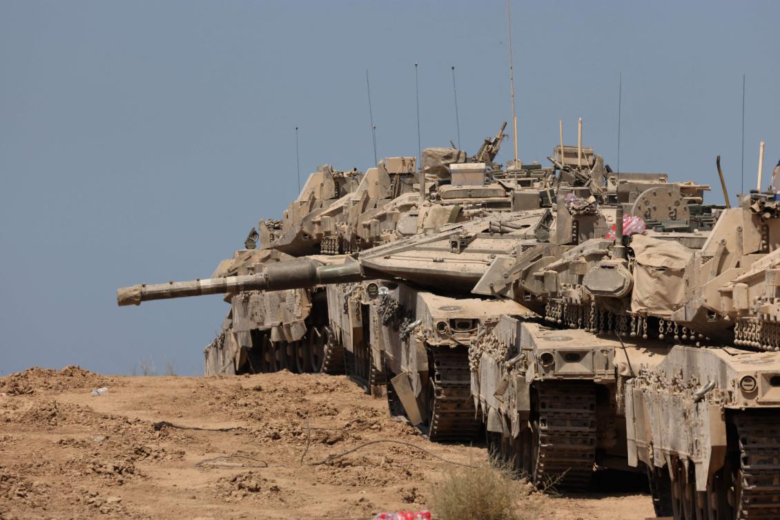 Israeli troops deployed near the Gaza border fence on Wednesday. (AFP)