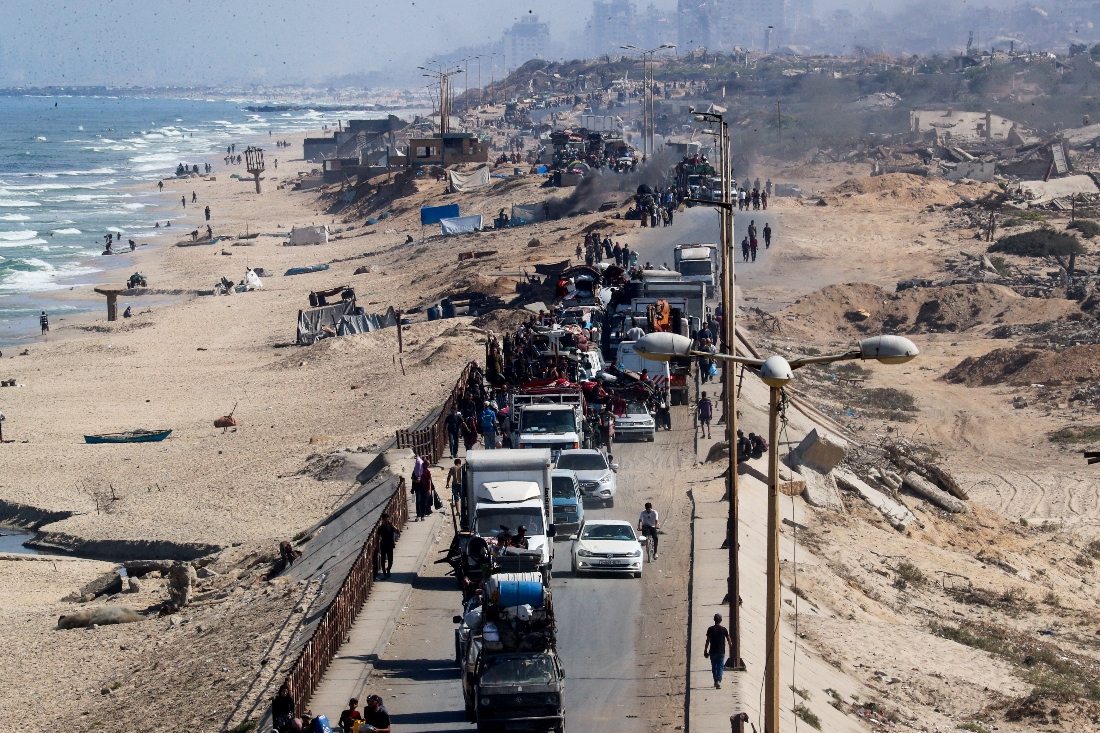 Displaced Palestinians, fleeing northern Gaza due to an Israeli military operation, move southward after Israeli forces ordered residents of Gaza City to evacuate. (Reuters)
