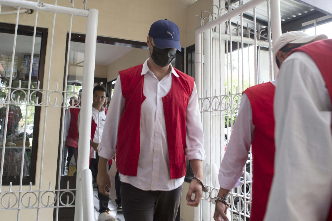 Ukraine’s citizen Roman Nazarenko, center, who is on trial on accusation of running a drug lab on the resort island of Bali, arrives for a hearing at the district court in Denpasar, Indonesia, Sept. 18, 2025. (AP)