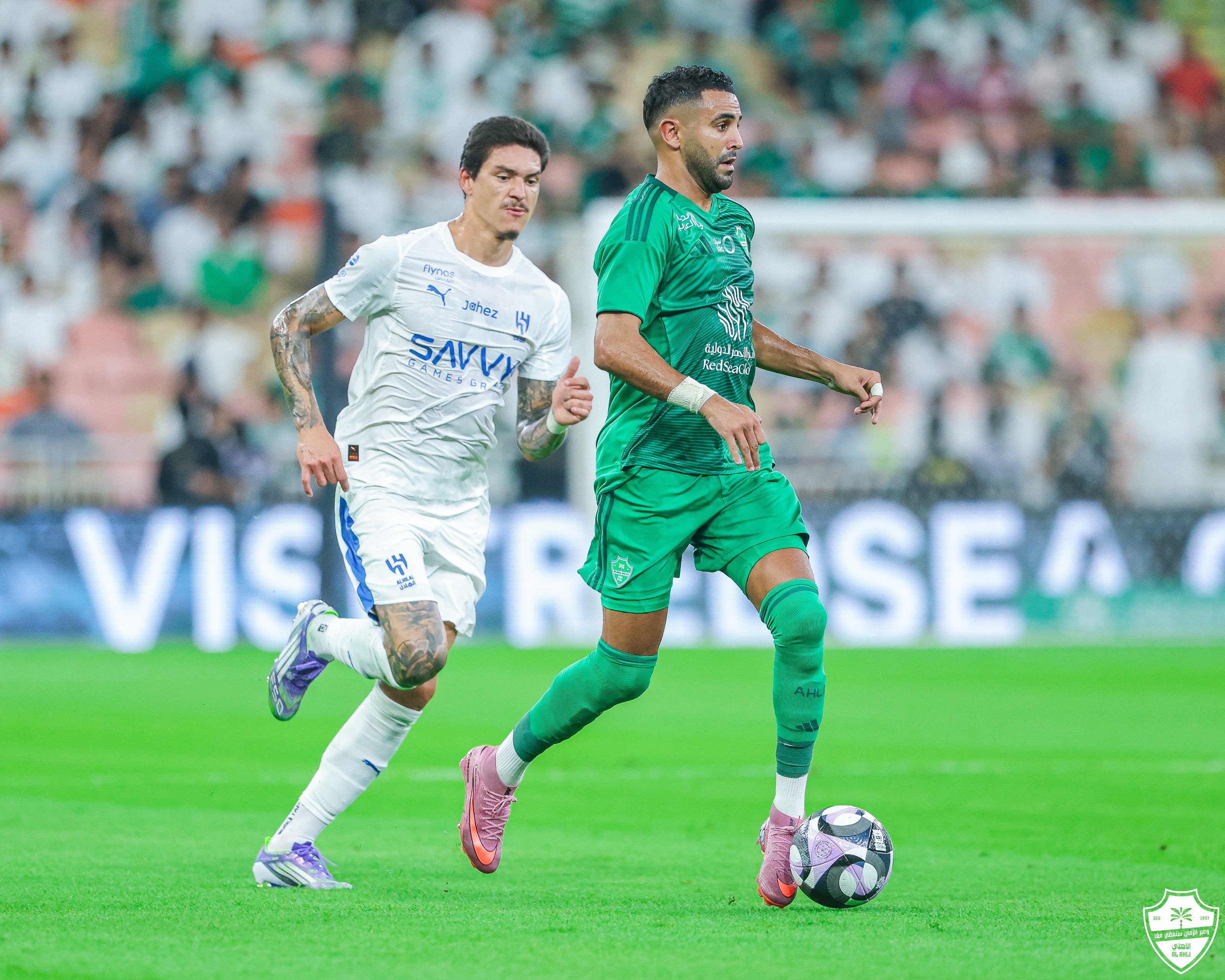 Riyad Mahrez provided two assists as Al-Ahli recovered from a three-goal deficit to draw 3-3 with visitors Al-Hilal. (X/@ALAHLI_FC)