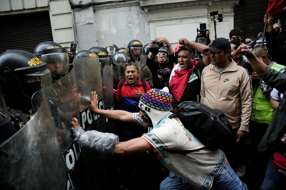 A demonstrator pushes police officers' shields during a protest against the government of Peru's President Dina Boluarte after Congress approved a partial withdrawal of private pension savings, a measure which could leave millions of Peruvians without retirement funds, in Lima, Peru, September 20, 2025. (Reuters)