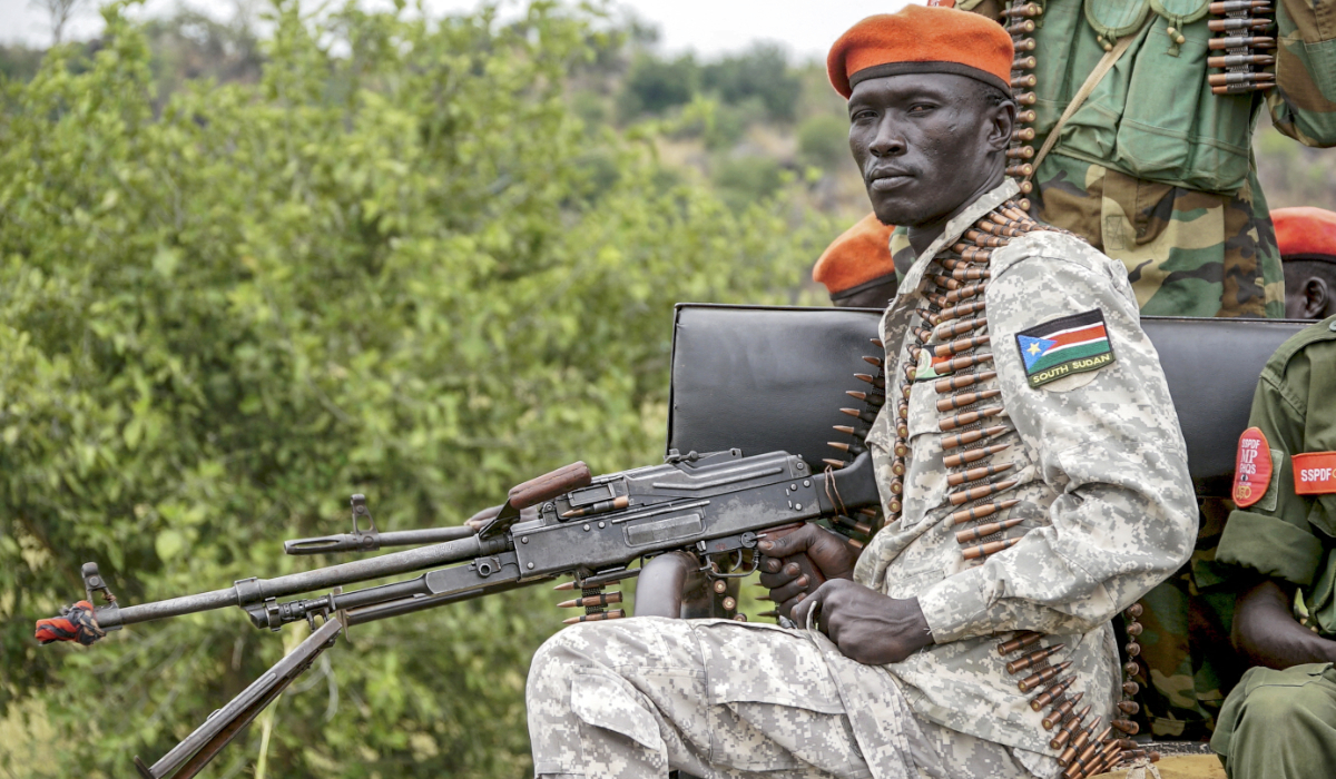 A South Sudanese military police officer sits on a pickup truck while monitoring the area as troops belonging to the South Sudanese Unified Forces take part in a deployment ceremony at the Luri Military Training Centre in Juba on November 15, 2023. (AFP)