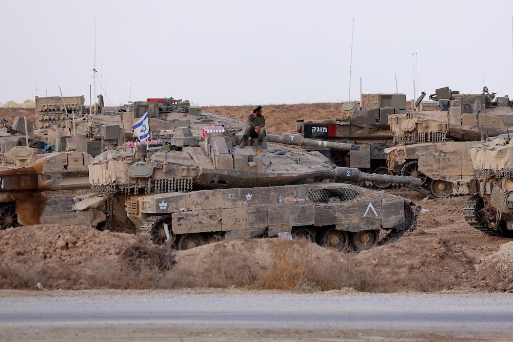 Above, Israeli military vehicles deploy at Israel’s border with the Gaza Strip on Sept. 19, 2025. (AFP)