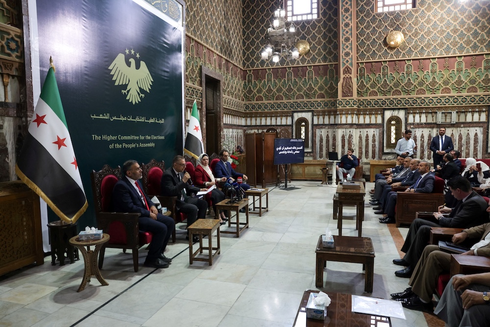 Members of the subcommittees for Syrian parliament elections sit at the Syrian parliament on the day they take an oath before the Higher Judicial Committee for Elections, in Damascus on Sept. 3, 2025. (Reuters)