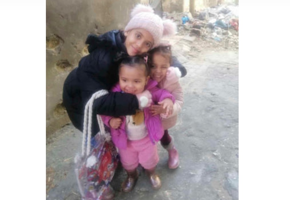 In this undated photo taken during the Israel-Hamas war, Noor Abu Hassira’s three daughters, Jouri, Maria and Maha, smile and pose in Gaza City. (AP)