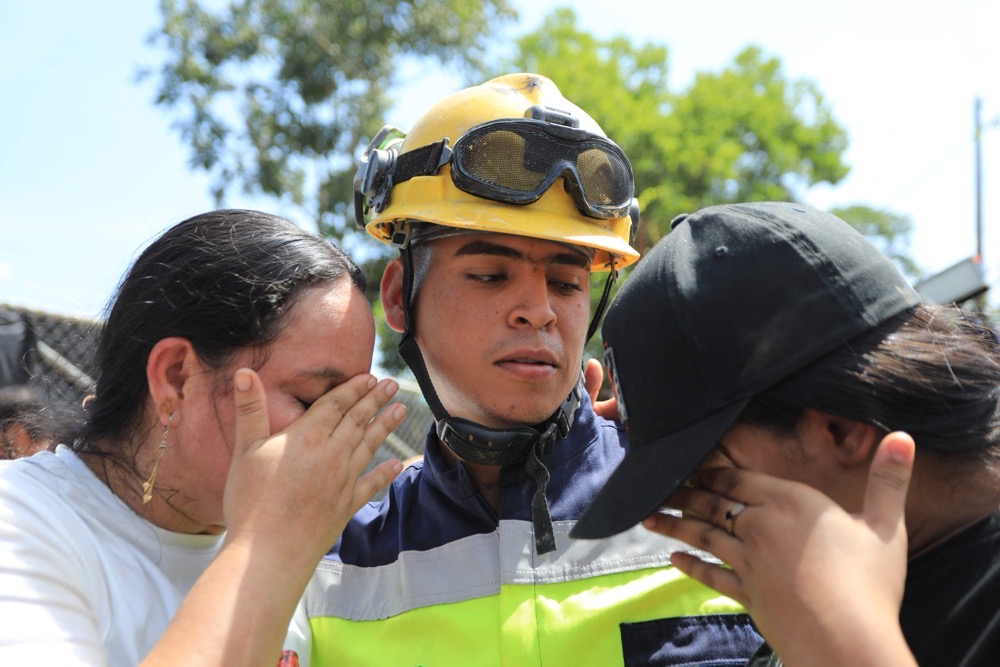 A rescued worker with his family. (AFP)