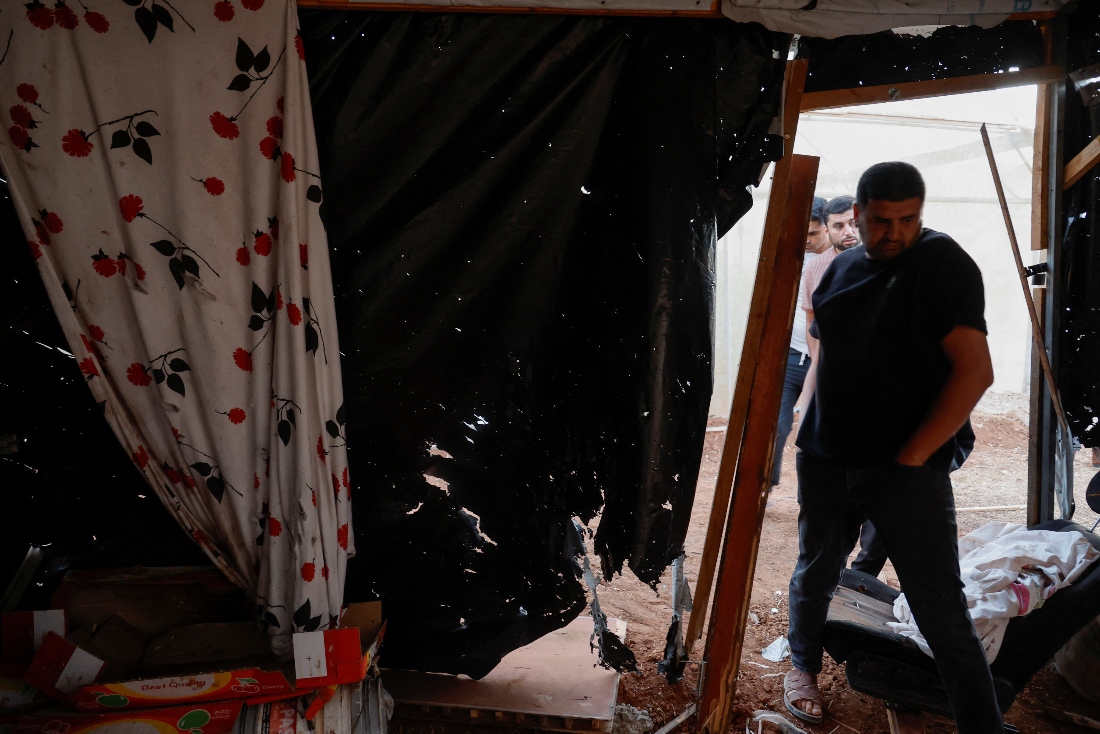 People gather at the site of an Israeli raid in Tammun, near Tubas, in the Israeli occupied West Bank. (Reuters)