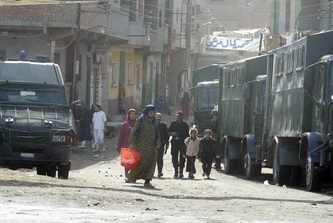 Egyptian riot police vehicles secure the gate of el-Dwakhliya village in the Nile Delta al-Mahalla governorate in 2005. (AFP)