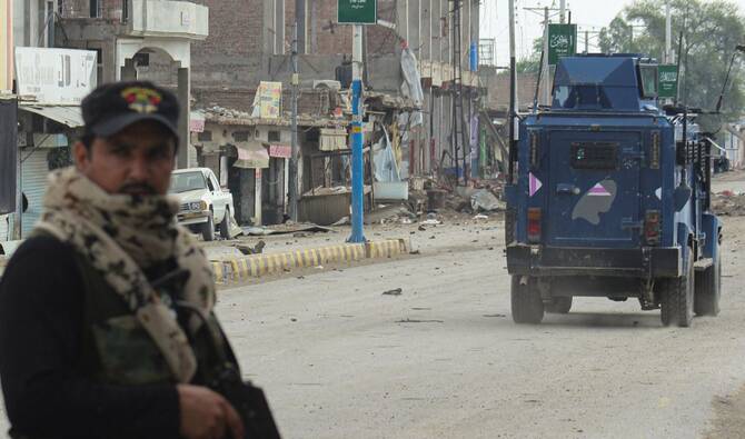 A police officer stands guard following a militant attack in Karak, Khyber Pakhtunkhwa province, earlier this month. (Reuters)