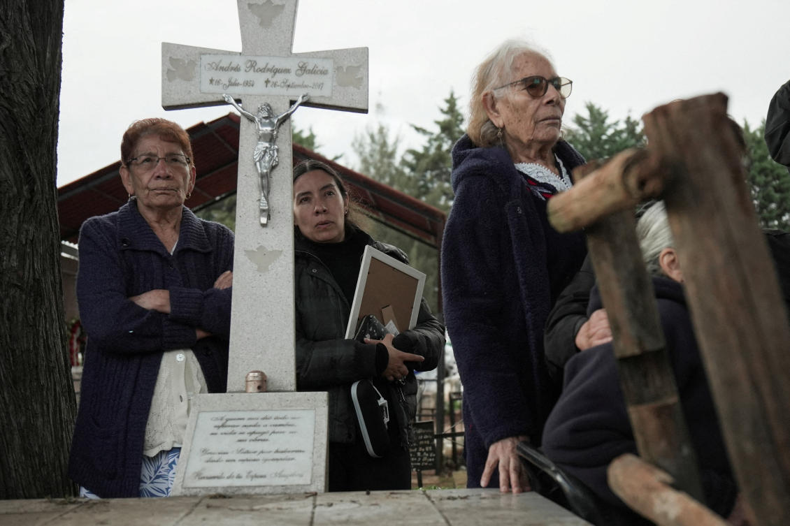 Relatives of Silverio Villegas Gonzalez, 38, a man from Michoacan who was fatally shot by a US Immigration and Customs Enforcement (ICE) agent in Franklin Park, Illinois, shortly after dropping off his two children at a nearby elementary school and daycare, attend his burial at a cemetery in Irimbo, Mexico, September 26, 2025. (Reuters)