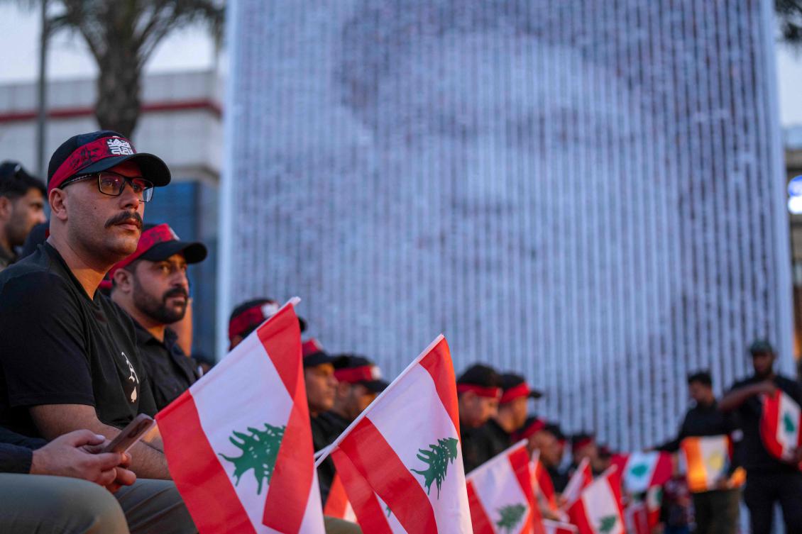 Iraqis attend a gathering to mark the first anniversary of the killing of Lebanon's Hezbollah leader Hassan Nasrallah in Baghdad's Tahrir square on September 26, 2025. (AFP)