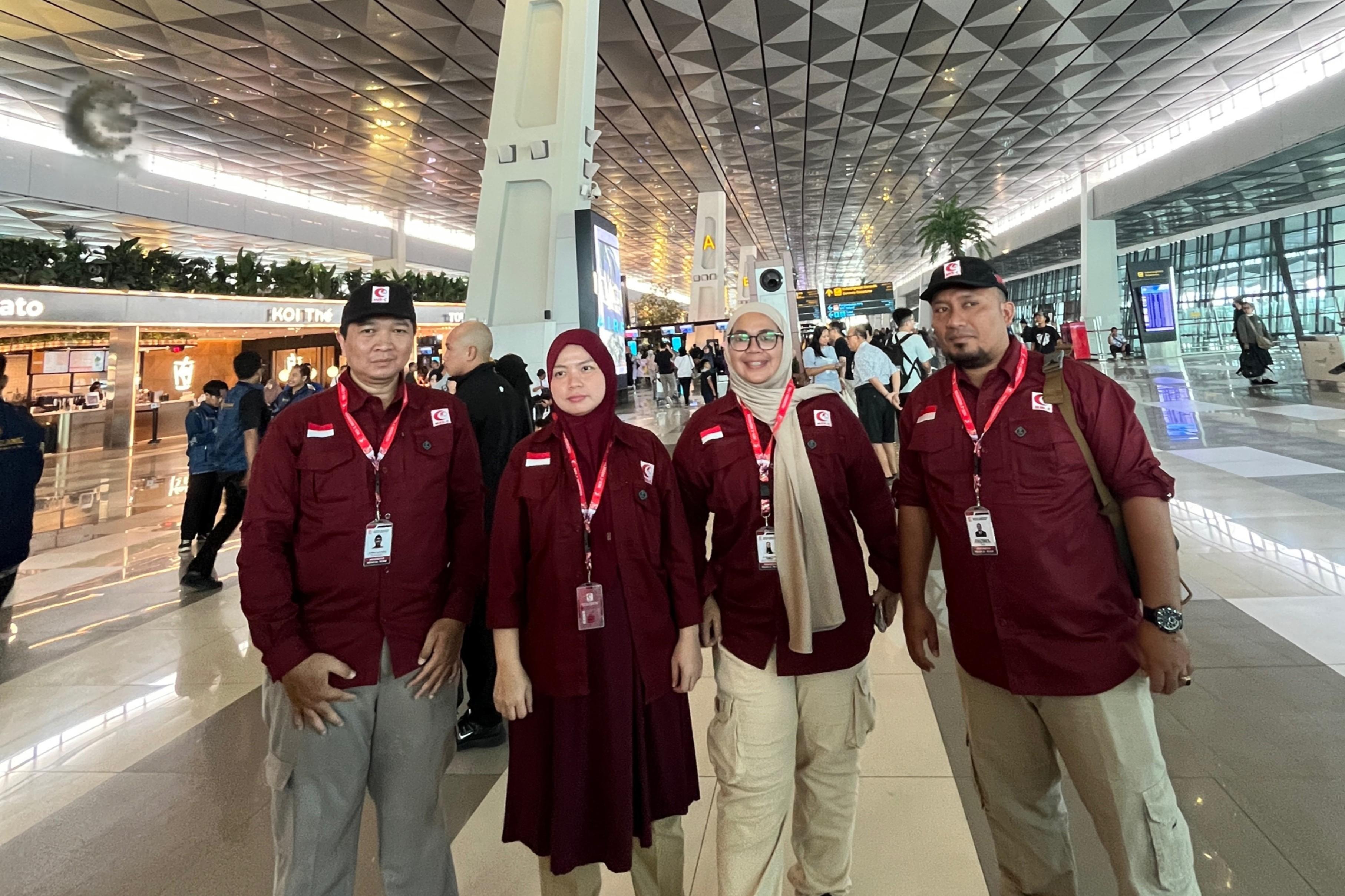 A team of Indonesian medics, which includes two women doctors, takes a group photo at the international airport in Jakarta before departing for Afghanistan on Sept. 23, 2025. (MER-C)