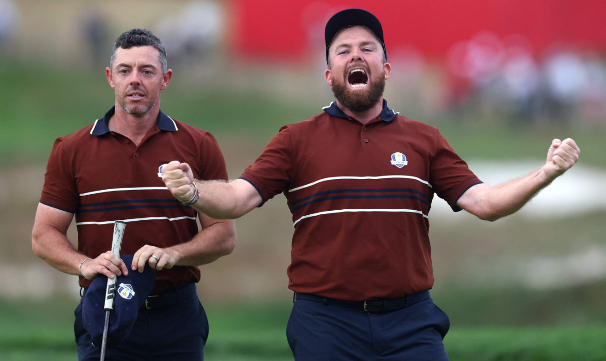 Rory McIlroy and Shane Lowry of Team Europe celebrate beating Justin Thomas and Cameron Young of Team US 2 up on the 18th green during the Saturday afternoon four-balls matches of the 2025 Ryder Cup at Black Course at Bethpage State Park Golf Course on Saturday. (AFP)