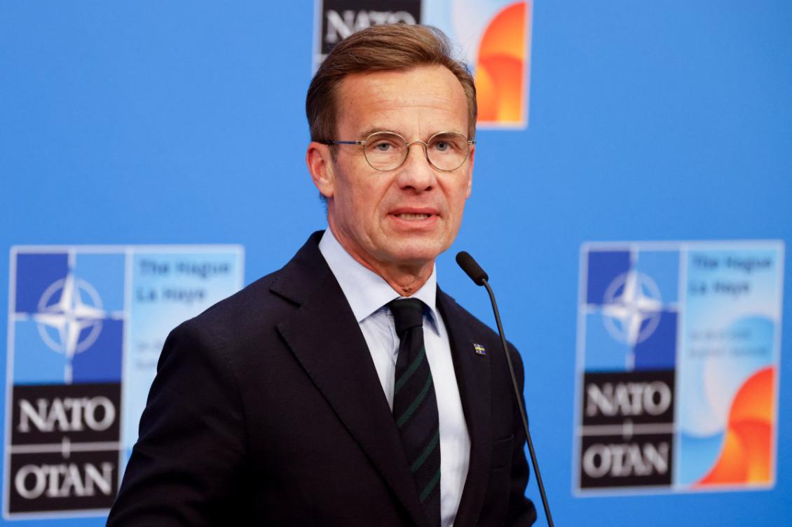 Sweden's Prime Minister Ulf Kristersson speaks to the media upon arriving to attend the North Atlantic Treaty Organization (NATO) Heads of State and Government summit in The Hague, on June 25, 2025.