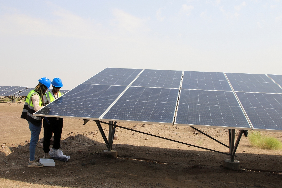 Technicians check solar panels at the Aden Solar Power Plant, Yemen's first large-scale solar power plant near Aden, Yemen. (Reuters)
