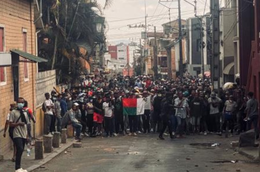Protesters holding a Madagascar flag gather during a demonstration against repeated water and electricity outages in Antananarivo on Sept. 30, 2025. (AFP)