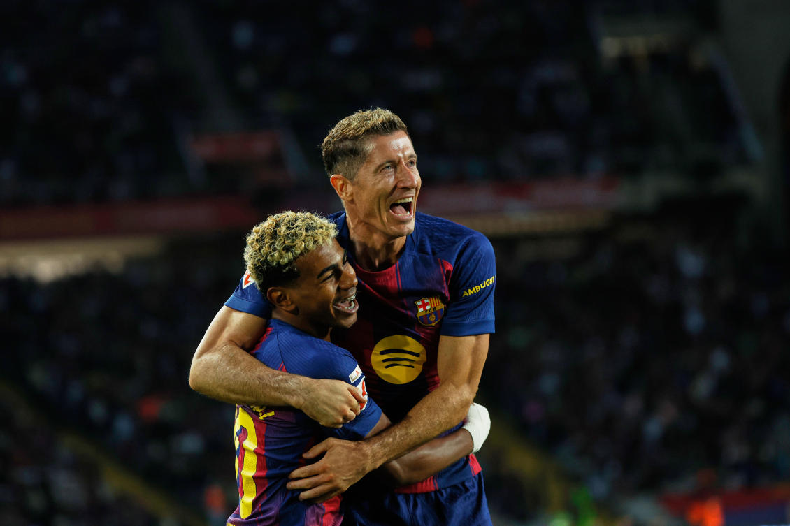 Barcelona’s Robert Lewandowski celebrates with Lamine Yamal scoring his side’s 2nd goal during their La Liga match against Real Sociedad at the Lluis Companys Olympic Stadium in Barcelona, Sept. 28, 2025. (AP)