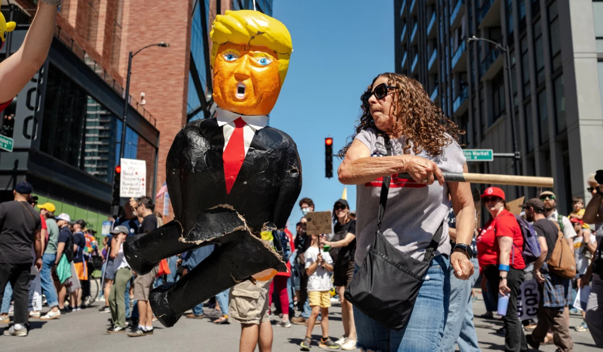 A person hits a pinata depicting U.S. President Donald Trump during a Labor Day protest in Chicago, Illinois, U.S., September 1, 2025. (REUTERS)