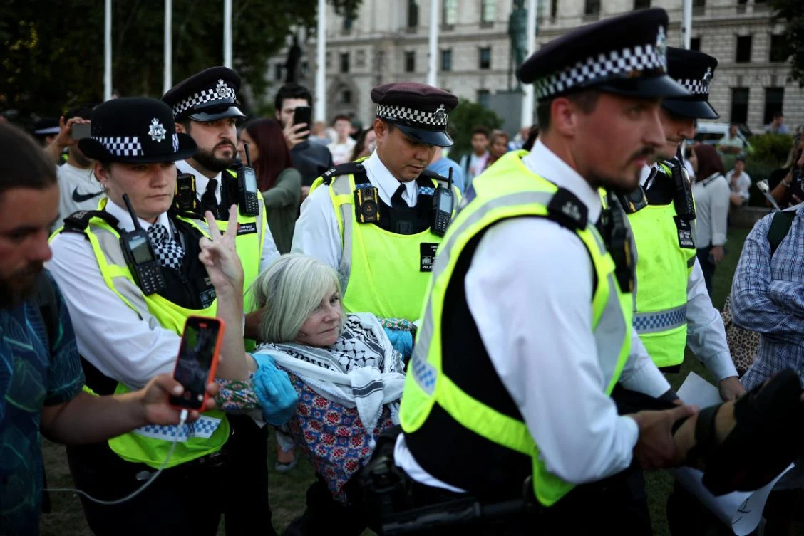 A protester is carried away by police officers at a “Lift The Ban” demonstration in support of the proscribed group Palestine Action in central London. (File/AFP)