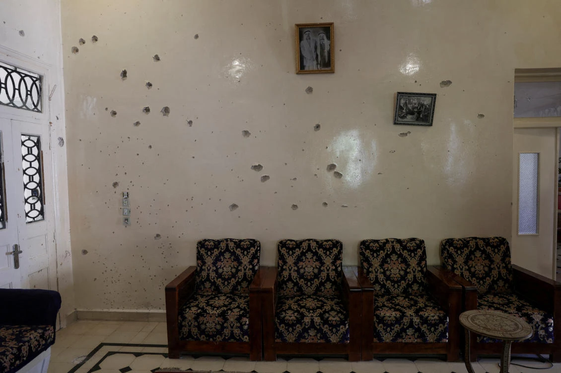 A wall is pockmarked by bullet holes inside the Saraya family house, following sectarian violence in Syria's Sweida province, where government forces were sent to quell local clashes between Druze armed factions and Bedouin tribal fighters, in the predominantly Druze city of Sweida, Syria, July 25, 2025. (REUTERS)