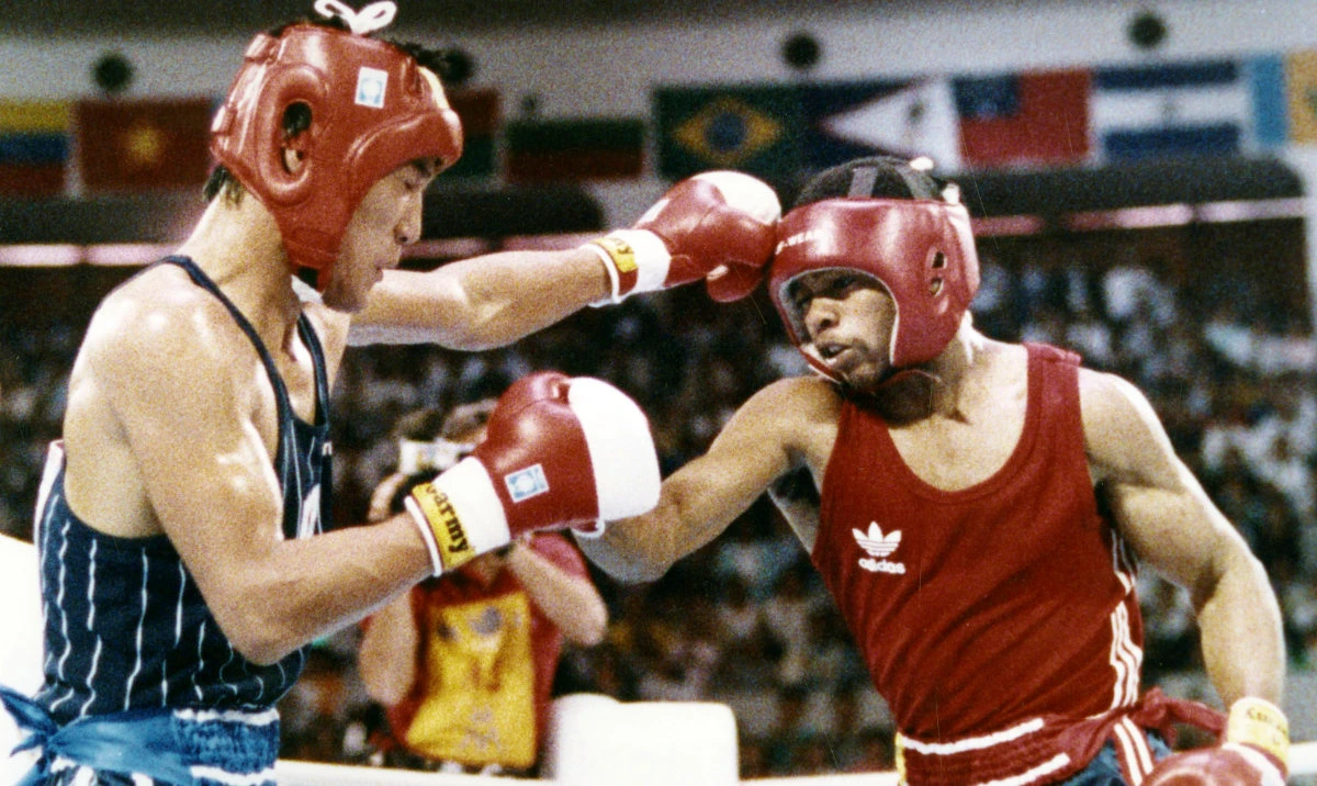In this Oct. 2, 1988, file photo, South Korea’s Park Si-hun, left, delivers a left jab to Roy Jones Jr. of the US, during the summer Olympics in Seoul. Park gave Jones the gold medal. The news was revealed Wednesday in a video posted on Jones’ YouTube page. (AP)