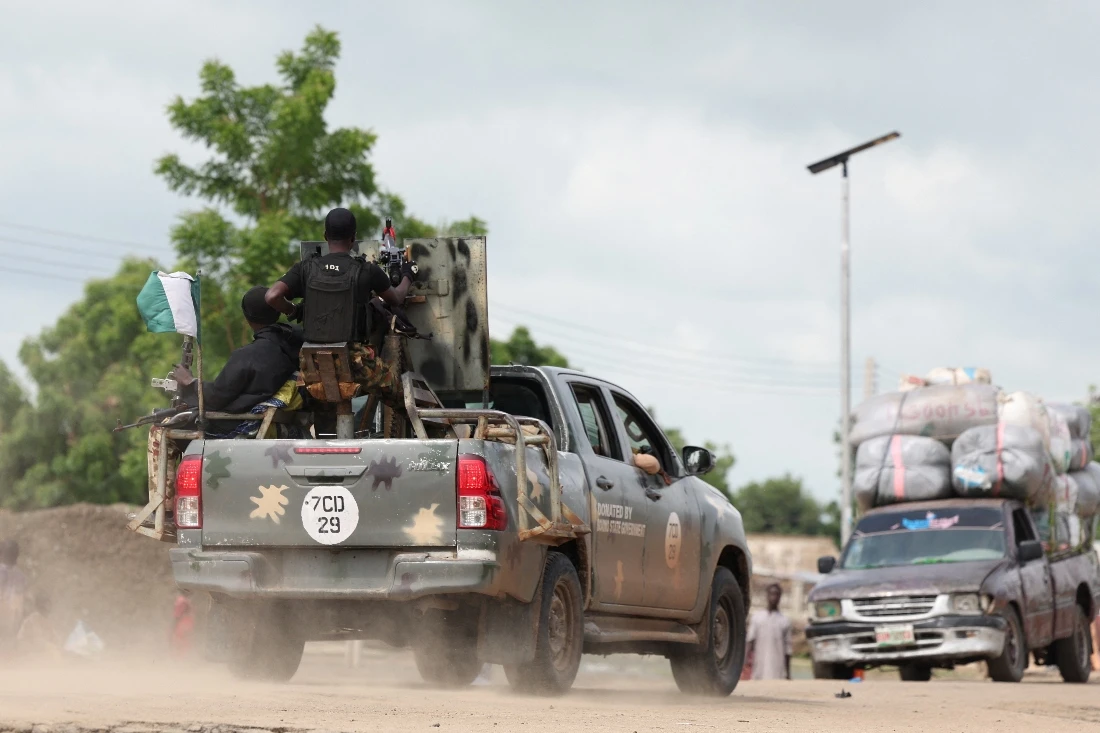 A Nigerian Army vehicle moves in the town of Dikwa during the dsitrubution of food aid to beneficiaries at a World Food Programme distribution centre in Dikwa, Borno State, Nigeria. (Reuters)