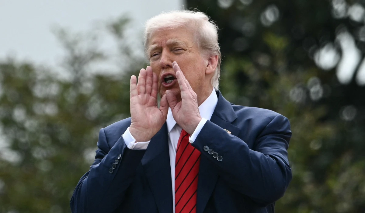 US President Donald Trump speaks to the press from a rooftop as he surveys the grounds of the White House in Washington, DC, on August 5, 2025. (AFP)