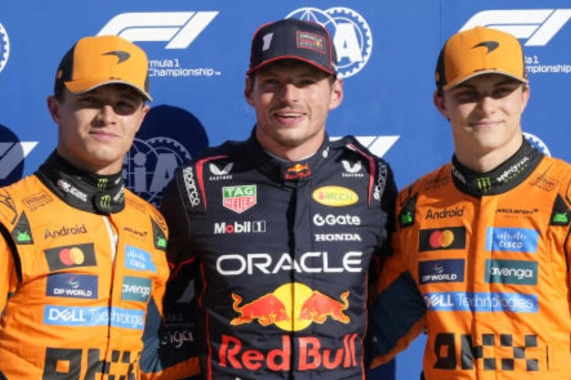 Red Bull driver Max Verstappen of the Netherlands, celebrates his pole position with McLaren drivers Lando Norris of Britain and Oscar Piastri of Australia after the qualifying session ahead of the Italian GP at the Monza racetrack in Monza, Italy, on Sept. 6, 2025. (AP)