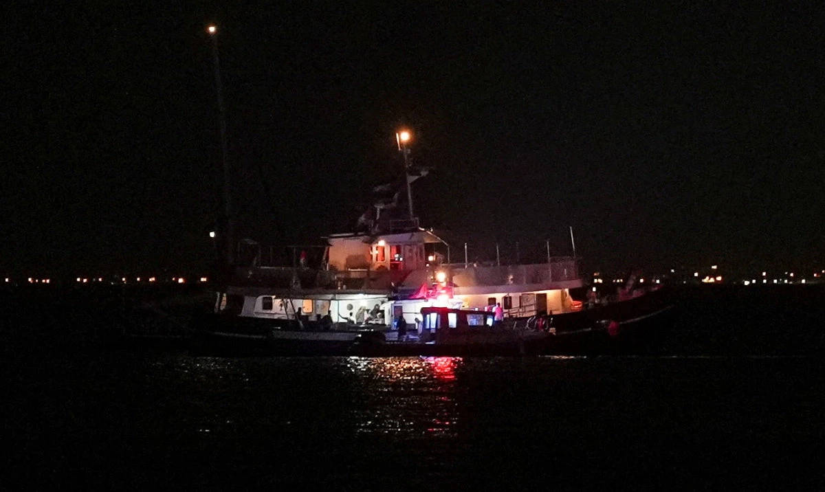 A Global Sumud flotilla vessel floats in the waters as Tunisian Maritime National Guard boats conduct an inspection in Sidi Bou Said, Tunisia, September 9, 2025. (Reuters)