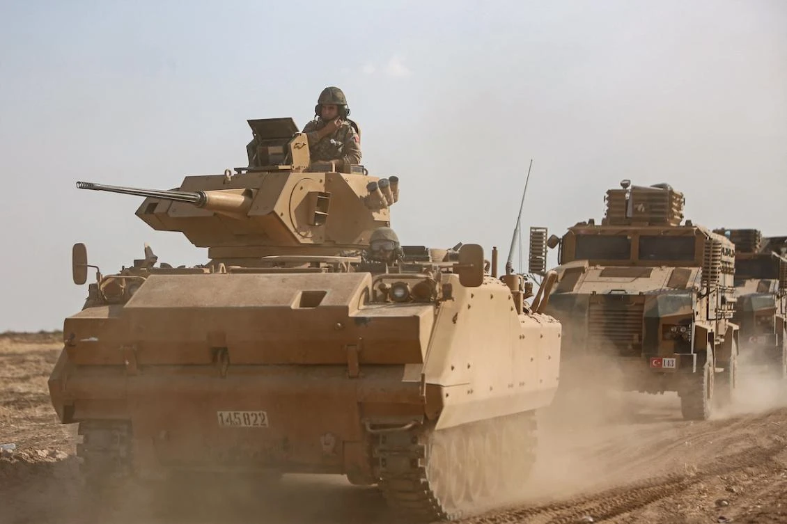 A Turkish armed forces convoy travels along the border between Syria and Turkey near the border town of Ras al-Ain in the Hassakeh province in northeastern Syria, on October 27, 2019. (FILE/AFP)