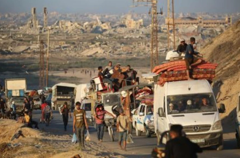 Palestinians fleeing south from Gaza City, ride vehicles with their belongings, on the coastal road near the Nuseirat refugee camp in the central Gaza Strip, on September 12, 2025. (AFP)