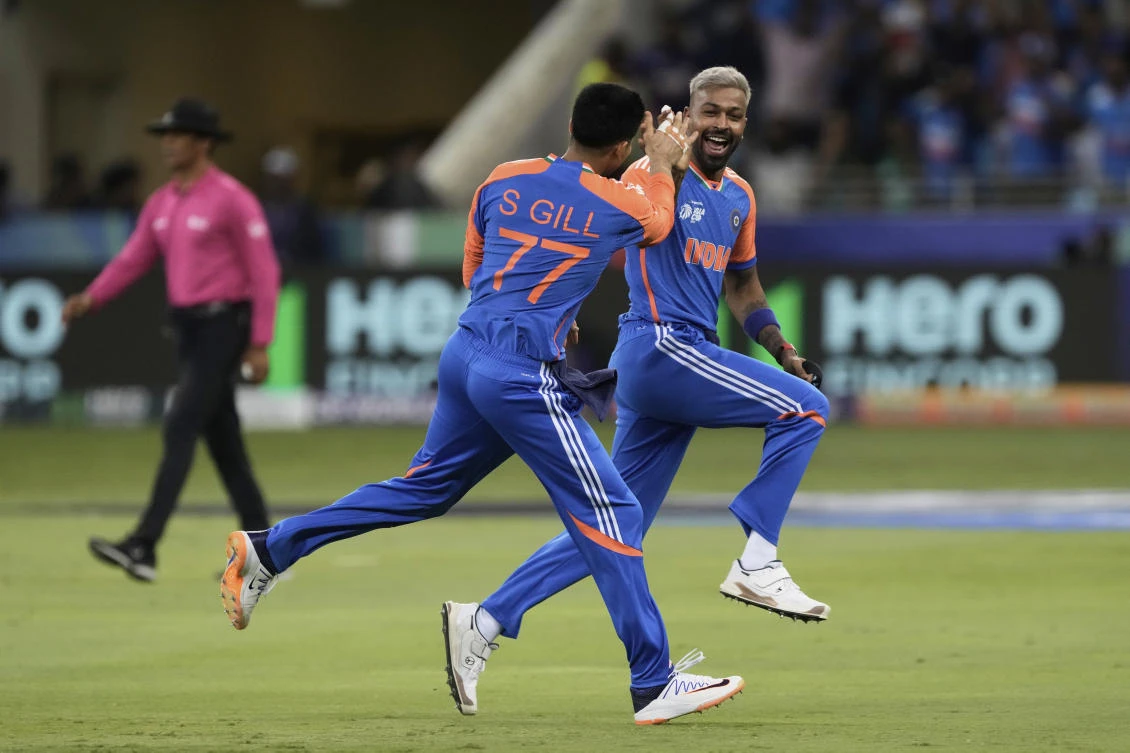 India's Hardik Pandya, right, celebrates with teammate Shubman Gill after the dismissal of Pakistan's Saim Ayub. (AP)