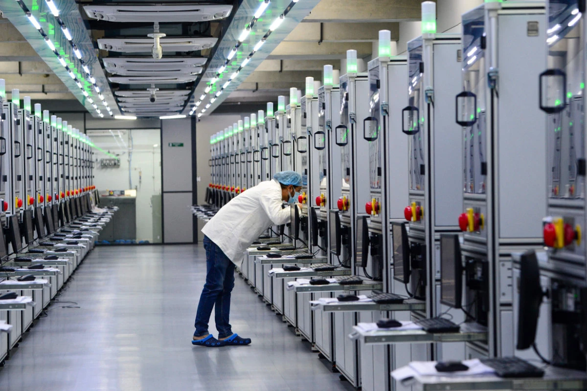 This photograph taken on February 6, 2024 shows a laboratory technician monitoring the progress of lab-grown diamond seeds at Greenlab Diamonds manufacturing firm on the outskirts of Surat, Gujarat, India. (AFP)